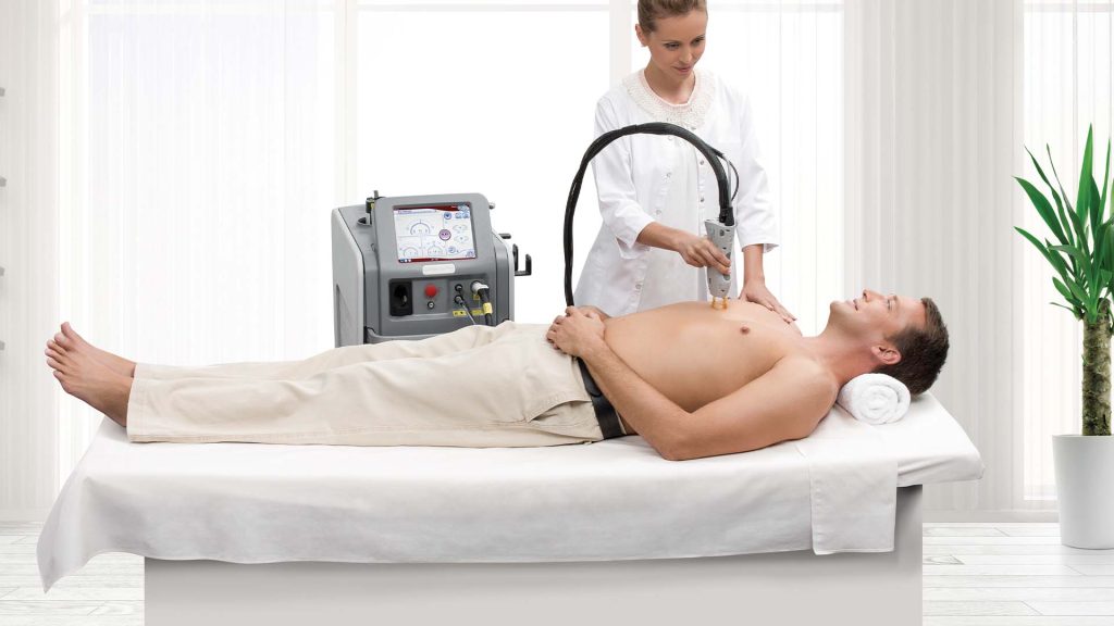 Expert performing Laser Hair Removal on a man's body